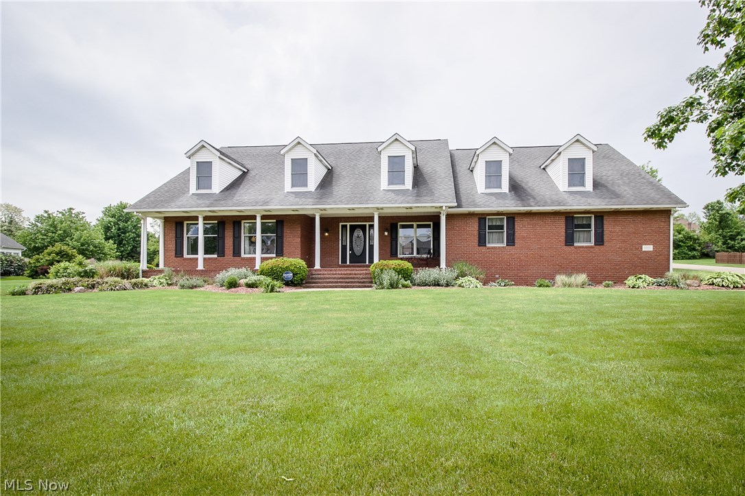ALL BRICK HOME IN JACKSON TWP'S MALLARDS CROSSING! Wow, over 3500 square feet of living space featuring solid cherry flooring & doors throughout. The welcoming porch leads you inside where you'll find a formal dining room with trey ceiling & crown molding plus an oversized living room at the front of the home. The kitchen is huge & offers an abundance of cherry cabinets, workstation, center island & newer stainless steel appliances. A spacious dinette can accommodate a large table & leads right out to the heated sunroom. The vaulted great room has a gas fireplace with floor to ceiling brick surround & French door access to the tiered deck. A 1st floor laundry leads to the 3 car side load garage. If you need large bedrooms, this is the house for you! The vaulted master suite has a walk-in closet, window seat & private bath with separate jetted tub, dual glass bowl vanity, & walk-in shower. The remaining bedrooms each have a nook, walk-in closets in 2 of the rooms & a double clo