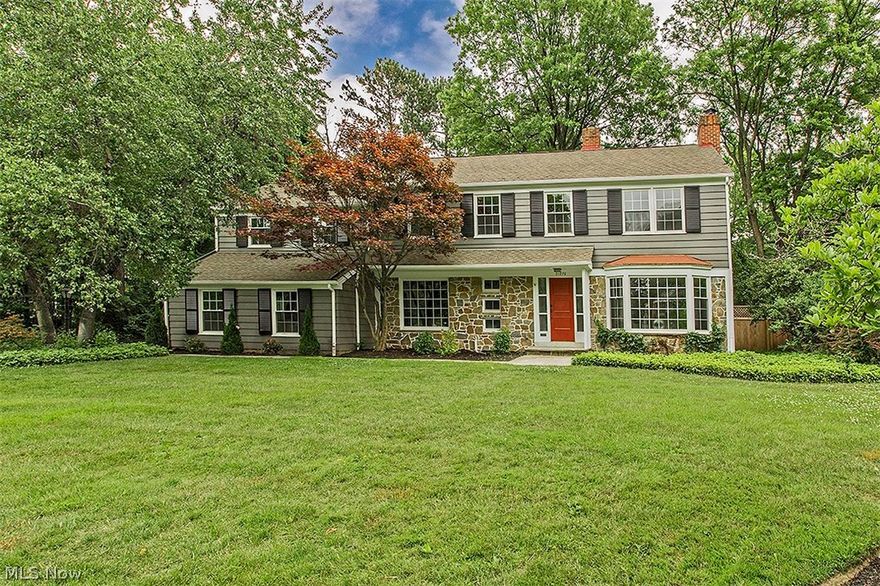 Completely renovated, this gorgeous home with nearly 4,000 square feet of living space creates the perfect combination of updated modern design and classic Shaker style. The open floor plan offers exceptional grace and charm with two fireplaces, refinished hardwood floors, and oversized windows. Greet your guests in the expansive living room with doors leading out to the inground pool. Off the living room is the open concept dining room and kitchen, great for seamless entertaining. The renovated kitchen showcases granite counters, a center island, white cabinetry with over and under cabinet lighting, as well as an eat-in area, perfect for casual meals or your morning cup of coffee. The first floor also boasts a family room off the kitchen and an office/den. The master suite is a truly relaxing retreat featuring a cathedral ceiling, beams, sliders leading out to a balcony, as well as a walk-in closet with built-ins. The master bathroom is encased in marble featuring a glamour bathtub, double sinks, and a walk-in shower. Four more bedrooms can be found on the upper level, including two with their own ensuite bathrooms. A cedar closet and laundry room rounds out the second floor. The lower level features a full wet bar with wine cooler and a recreation room with a fireplace. Outside, enjoy the Cleveland summers with your own inground pool, fenced-in and ready for your delight. Don't miss the uncompromising luxury of this home in the heart of Shaker Heights!