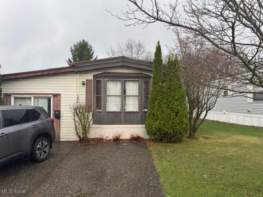 Charming Fixer-Upper in Desirable Maywood 55+ Community! Opportunity knocks! This 2-bedroom mobile home is nestled in the highly sought-after Maywood 55+ Community, offering a fantastic chance to make it your own. Featuring an open-concept
layout, this home provides a spacious feel with endless potential. A unique highlight is the converted sunroom, formerly a garage, now enclosed with a glass sliding door- perfect for additional living space, a hobby room, or extra storage. The home also includes an accessibility ramp in the back for easy access. While some updates and TLC are needed, this property is full of possibilities. Whether you're looking for a personal retreat or an investment opportunity, this home is priced to sell and ready for its next chapter. All information is believed to be accurate but not guaranteed.  Don't miss out on this chance to customize a home in one of the area's mot desirable 55+ communities!