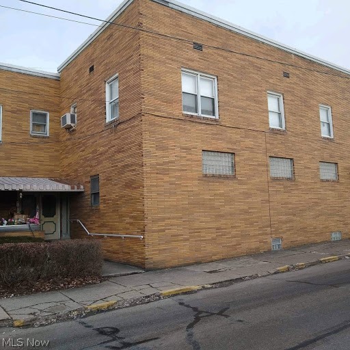 Large brick four unit with large open first floor unit that can be partitioned to accommodate multiple bedrooms, full basement, two car attached garage with engine hoist. Second floor includes three units with full kitchen, living room and full bath and two bedrooms. Second floor common area can access the three units. New roof recently installed, interior has been well-maintained. Building is over 5000 total square feet and has easy access to St Rt 7.