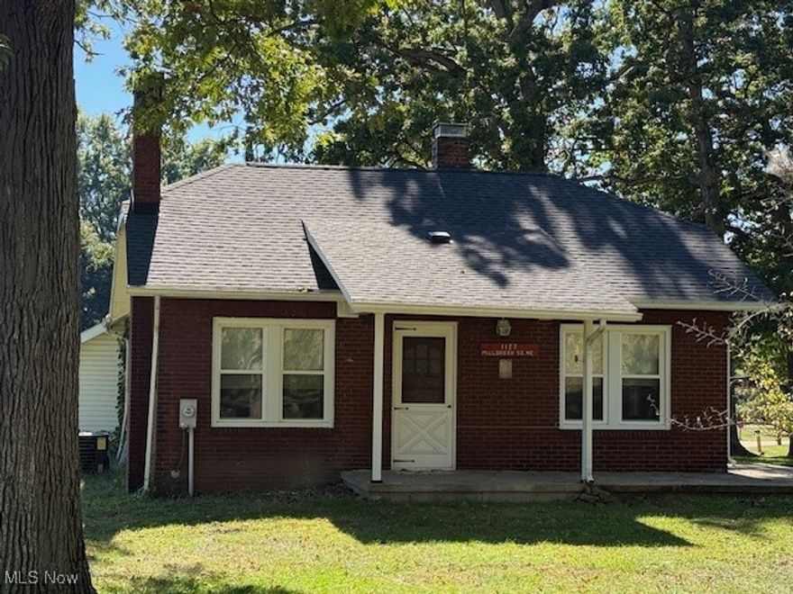 Agent Owned. Spacious brick / vinyl cape cod home in a great neighborhood. Located in a quiet cul-de-sac located just minutes from shopping, restaurants and I-77 access. Home sits on just over 1/2 acre. The main floor of the home features a kitchen, living room with brick fireplace, dining room, 1st floor bedroom and 2 updated full baths. Laundry room and a covered 10 x 22 patio. The upper level includes 2 room that could be used a 2 bedrooms. This home has been updated in the last 5 years, which includes: new shingles on roof, new windows, new plumbing and electric in the baths. New hot water heater. There is a 28 X 30 attached garage which has a/c and heat and an additional 16 x 20 workshop. Call today for a private showing.