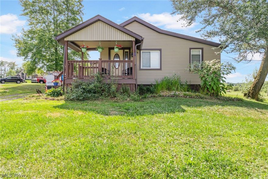 Main house has large living room with large kitchen and dining room, it is wide open. There are 2 large bedrooms with bath. Full basement that has plenty of storage area. Laundry room is not complete, needs paint and floor coverings. Large barn with 2 stories & steel storage area to boot.
24x30 Conex style outbuilding with 14ft door