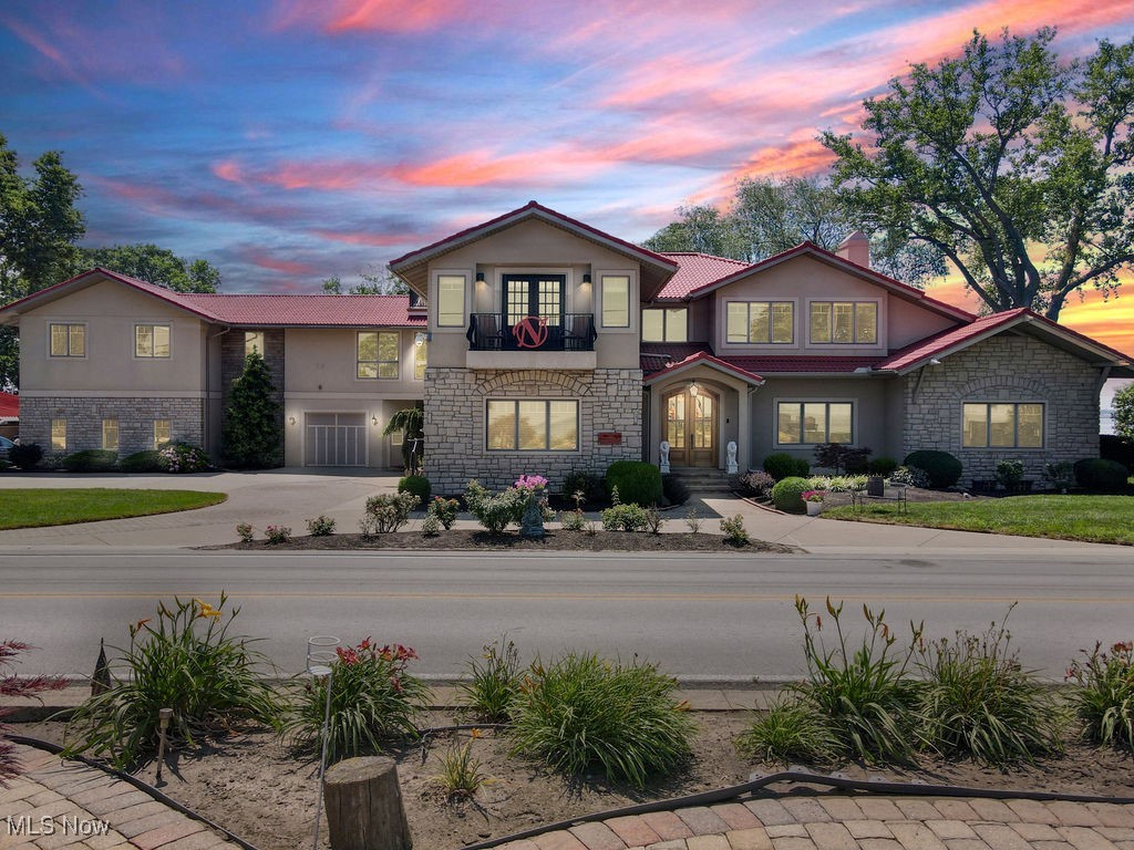 Now offered at a price improvement of $2,749,900,Welcome to 1431 Cedar Point Road, a rare lake-to-bayfront luxury estate on one of the most desirable stretches of waterfront in Sandusky, Ohio. This 7,880 sq ft custom home was mostly torn down and completely rebuilt in 2012, blending modern construction with timeless design.” This property is the ultimate coastal lifestyle, featuring 165 feet of private deeded beach on Lake Erie and a 70-foot dock with a 7,000-lb boat lift on Sandusky Bay. With five bedrooms, seven full bathrooms, two half baths, and a three-car garage, the home is designed for both grand entertaining and comfortable everyday living. Inside, you’ll find rich hardwood floors throughout, a gourmet kitchen with granite counters, stainless appliances, and three wet bars—two with ice makers. A temperature- and humidity-controlled wine cellar with custom racking and granite surfaces is a true showpiece.Additional highlights include a private elevator, a spiral staircase leading to a crow’s nest with panoramic views, and four fireplaces. The primary suite is a luxurious retreat with a walk-in closet, glamour bath featuring dual vanities, oversized shower, jetted tub, and a private lakefront balcony. Four of the five bedrooms include en-suite baths, perfect for hosting family and guests. Outdoor living is equally impressive with multiple balconies, lush landscaping, and a stunning private beach house complete with a fireplace, wet bar, and half bath—ideal for lakeside gatherings.This is a once-in-a-generation opportunity to own an extraordinary waterfront estate that seamlessly combines elegance, comfort, and lifestyle. Schedule your private showing today.