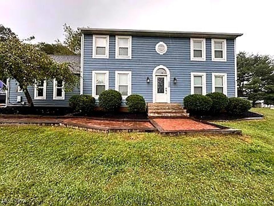 $15,000 PRICE ADJUSTMENT!  Stately home features a traditional layout and is situated on nearly an acre lot.   Front door opens to a grand two-story foyer.  The main floor boasts a formal living room, formal dining room, eat-in kitchen and a vaulted-ceiling den off the dining room.   Also, there is an additional room currently being utilized as a bedroom.  There's beautiful hardwood flooring throughout most of first floor.  Conveniently located laundry room and half bath complete the first floor.   Second floor features four bedrooms with a main hallway full bath.  Master bedroom has a private bath with both a shower and a jetted tub.  Several rooms have new farmhouse style ceiling fans.  Two-stall attached garage has a bonus room over it, which could be used as additional living space or storage.  At the back of the property, there is an additional detached garage/storage building.  Walkways and landscaping have been refreshed.  Don't miss your opportunity to add your own touches and make this your new home.  Priced below market value appraisal.  *Property does NOT require flood insurance.