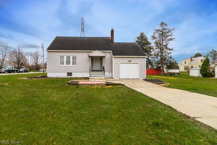 WOW!  Many sunshine filled rooms and loads of charm! Features refinished hardwood floors, brand new stainless appliances (refrigerator, stove, microwave, dishwasher, and garbage disposal), 3 bedrooms, 2 full baths, laundry room, full finished basement with glass block windows, new central air, new carpet, professionally waterproofed, attached garage, concrete driveway, 20x16 carpeted covered patio, newer vinyl siding and replacement windows, large yard, and corner lot. *Must see inside! All window treatments included.