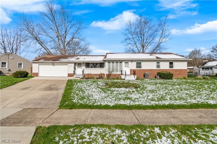 Fantastic ranch home in the heart of Stow, Ohio! Pride of ownership is evident in this lovely 3 bedroom, 1.5 bath home which was professionally cleaned and is move-in ready for immediate occupancy! The main level has a large family room with low maintenance laminate flooring and recessed lighting. The dining/living room features a vaulted wood beam ceiling and leads into the well-appointed galley kitchen that comes with all appliances. Down the hallway is a full bath and 3 bedrooms each with beautiful original hardwood flooring, and the primary bedroom has a convenient attached half bathroom. Enjoy the view of the fenced flat backyard from the cheerful enclosed porch with skylight and ceramic flooring for 3-season entertainment. The clean and dry basement has been partially finished and provides an additional 600 sq. ft of living space, a work area, and a pleasant laundry area with included washer and dryer! HVAC was serviced in 2021 and nature stone flooring was installed in the tidy