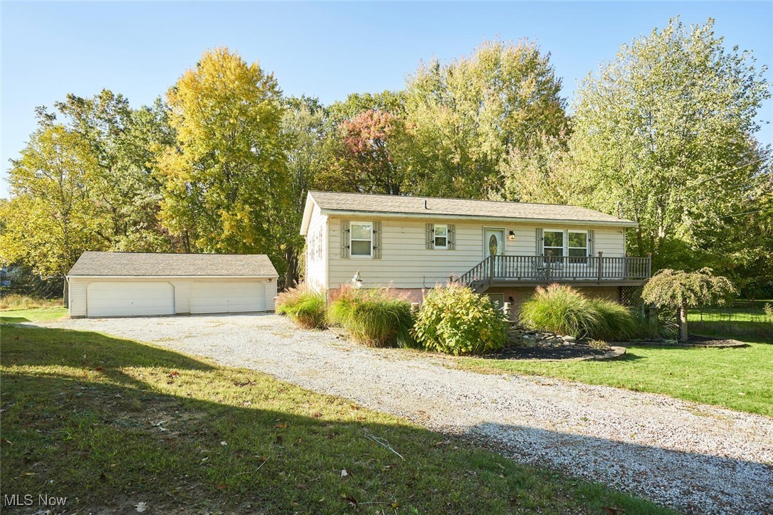 Nicely updated 3 bedroom with an Amazing 4 car garage (40x30) complete with heat and 220. Updated eat in kitchen walks out to remodeled deck and pool (with new liner) private backyard. LVT flooring throughout, this home is perfect for entertaining! Lower level has a rec room with bar, theater/media room and a half bath. Just a short walk across the street to the lake! call today for your private showing