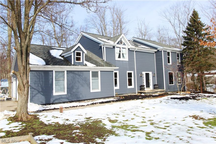 Highly sought-after Lake In The Woods neighborhood. 4 bedrooms 2.5 bath, 3 car side entry garage, center hall colonial. This lovely home features hard wood entry, open 2 story turned staircase, wonderfully large living room and family rooms with wood beamed ceiling in the living room. Updated center island kitchen with granite counter tops that complement the hard wood flooring. Live in harmony with nature with the bayed family room windows, fireplace and deck overlooking a heavily wooded back yard with your own private pond and barn. The upstairs loft leads to 3 additional bedrooms and a gorgeous well-appointed master suite. Reclaimed wood from a barn in Central Ohio was used in various aspects of the home including the railing and living room built-ins. New updates to the home include: siding (2018), AC/Furnace (2017), water softener(2015), well pump (2015), reclaimed lumber library(2017), deck (2015) basement doors(2018), new hardwoods in the first floor(2019), master bath (2018) an
