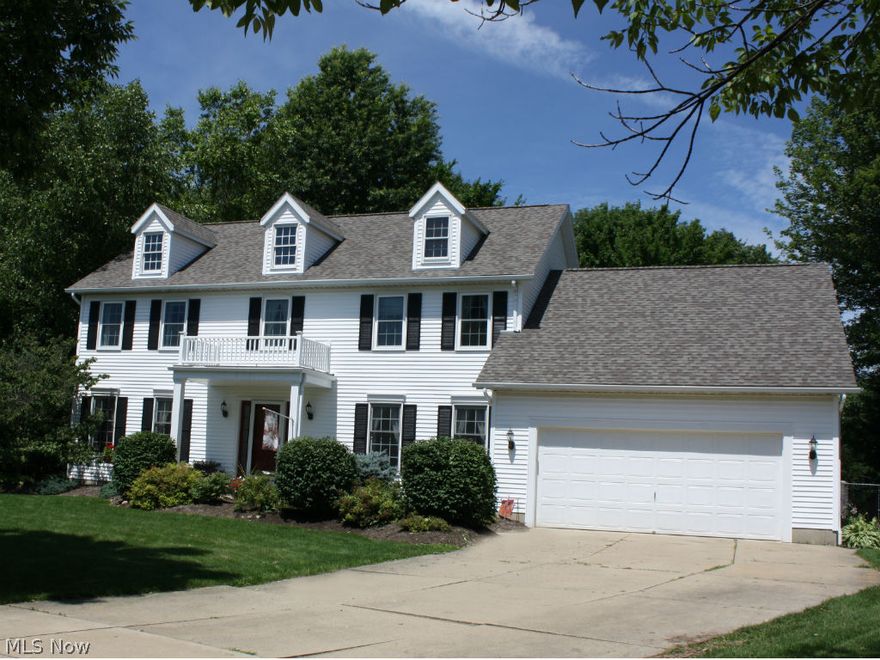 Welcome Home! This 5 bedrooms, 3.5 baths colonial sits on .52 acres. Enjoy privacy at the end of the cul-de-sac with wooded back yard, 2 decks, custom paver patio and fenced in yard. 1st floor features a full bedroom/bath suite or office with walk-in closet and separate private entrance. All 4 baths have been recently updated, 3 with granite. Kitchen features Corian counters and new stainless appliances (2014). Master bedroom features vaulted ceiling with opening to dormer window, skylight in master bath, large jetted tub and brand new shower (2015). Newer roof and 75 gallon hot water tank in 2014. New A/C, skylights and most windows (2014). Many of the closets are custom fit with California Closet systems. Family room features gas fireplace with french doors to front room. Crown molding throughout most of the first floor including the recessed ceiling in the dining room. Basement media room is complete with built-in walnut and glass cabinetry, wine fridge & surround sound. Basement al