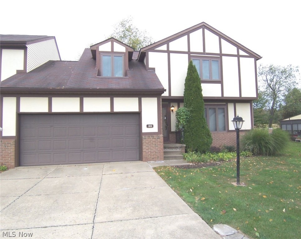 Welcome to 33 Tudor Lane! This lovely three bedroom condo is located in Brimfield at Just Cricket. All three bedrooms are large and bedroom 1 and 2 have two closets. The huge master bedroom has two closets as well as a walk-in closet. The kitchen is fully applianced and has an eating area and a pantry. The first floor laundry is off the half bath and has a large closet and the wallpaper has been removed. The living room is huge and has a gas fireplace. This condo is located close to shopping and Route 76 Expressway. There is a stocked lake, an in-ground swimming pool and a clubhouse. There is an attached TWO-car garage with pull-down stairs to a storage area. There are sliders from the dining room to a large screened porch with a small deck attached, and it walks out to a very private back yard. There are replacement windows, and the furnace was replaced in 2013, and the a/c in 2010. The H20 and the sump pump were replaced in 2004; the garbage disposal was replaced in 2009. The present owners have an electric stair-climber that is used to go upstiars. This will be left at the condo or the owners will remove it if the buyer does not want it. The owners are offering a one-year APHW for the buyer's comfort! Hurry and make your appointment - this condo is priced to sell!