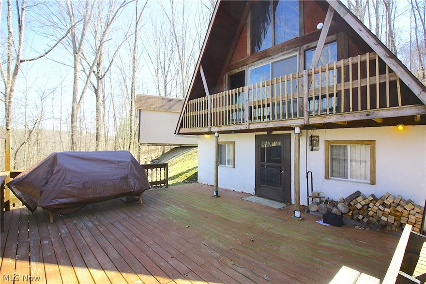 CLENDENING LAKE CABIN!! One of Eastern Ohio's best fishing lakes, Clendening is a Muskingum Watershed Conservancy District lake and the largest undeveloped lake in Ohio with over 1,700 surface acres and 37 miles of shoreline. Clendening offers a true back-to-nature experience, far from the crowds, yet close to home. It's a great place for boating, fishing, paddle sports, hiking and much more. 10 HP max. Only minutes to Clendening Marina and also less than 10 minutes to Tappan and Piedmont lakes. Adjacent to thousands of acres of public hunting. With an industrial look the Living room & kitchen are on the lower level with access to the large deck. Main floor is currently used as a large open bedroom. The Unique loft area can be used as a second bedroom. Large storage building. Cabin is on private land and not subject to MWCD lease fees. Road is maintained by Nottingham Township.