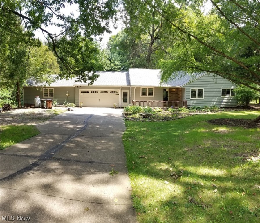 Large 3 bedroom ranch. Possible home business/office, attached to home is a 22x15 bonus room previously used as a pottery business with back entrance. Could be in-law suite. Home features a fireplace in living room as well in lower level. All bedrooms have original hard wood floors. New roof in 2021. Gently sloping lot with private backyard. If you are looking for a house with lots of space and possibilities this could be the one.