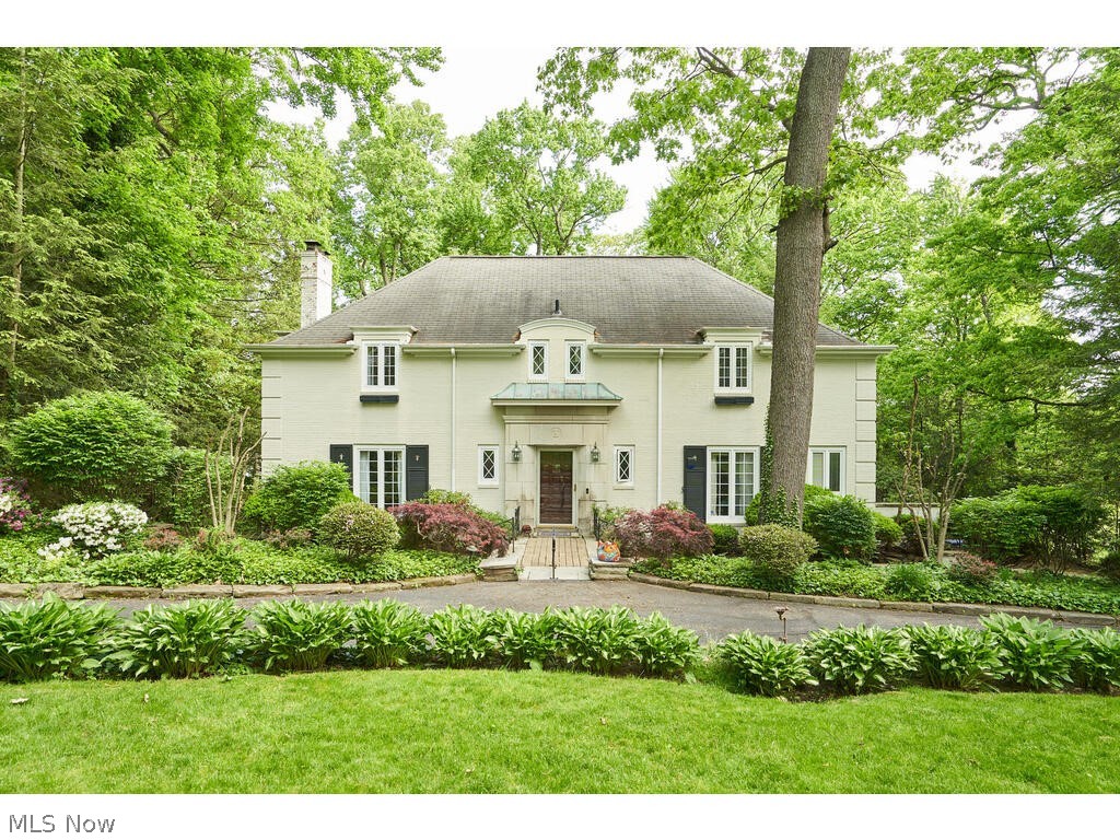 Privately situated on one of the most charming streets in Fairlawn Heights, this French Provincial Colonial boasts 4 bedrooms and 3.2 baths. The foyer is flanked by a formal living room with a fireplace and a formal dining room. A four-season sunroom with a fireplace spans the entire rear of the home, serving as a family room with two French doors leading to two separate decks. The main level also includes a private library/ study with built-ins, the kitchen, a laundry room, and a half bath. Dual staircases lead to the second floor, featuring four bedrooms and three full baths, including the primary suite with walk-in closet and beautiful master bath. This elegant home offers both timeless charm and modern convenience. Updates include electrical, new gas boiler (2019), hot water tank (2024), reverse osmosis system, and more. Enjoy a short trip to the West Side Bakery, 750ml Wine Bar, & More! Schedule your private showing today!