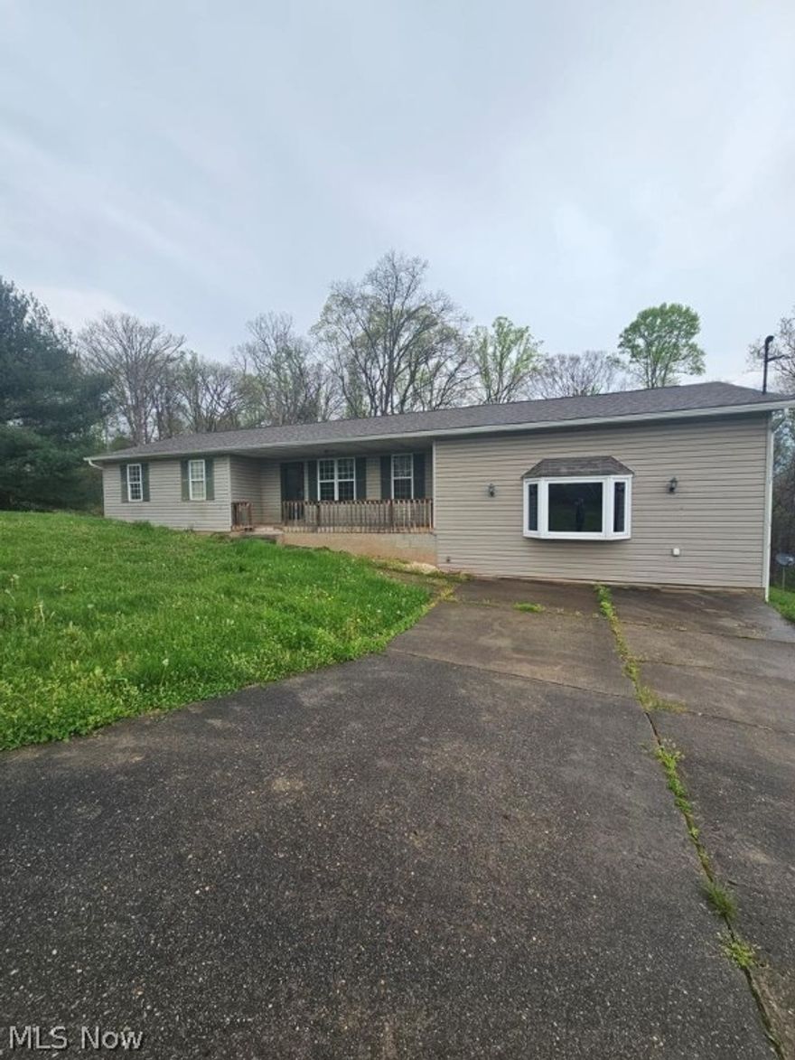This home sits on 1.59 acres just beyond citylimits. It boasts 3 bedrooms, 2 bathrooms, and a spacious detached 2-car garage. Additionally, there's a convenient parking pad suitable for a camper or boat.