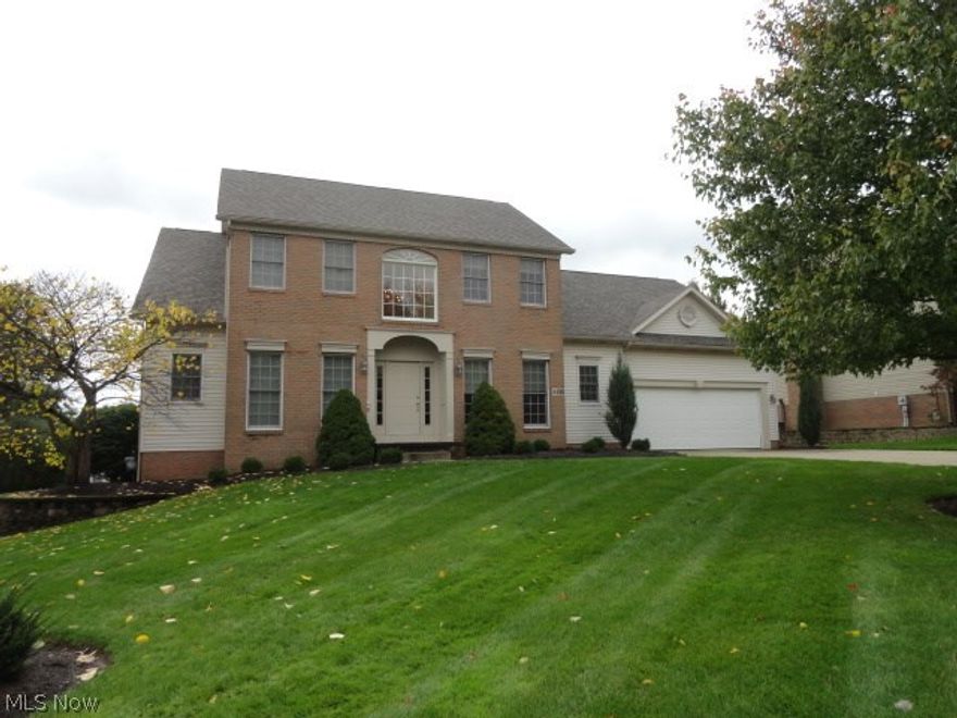 1st floor Master Bedroom, Living Room, or Office and spacious Laundry, finished Lower Level, spacious Kitchen and Dinette and vaulted ceiling and fireplace in Great  Room. New furnace and air, roof and hot water tank in 2016, brand new tiled walk-in shower in Master Bath. 4 car garage too! Convenient to Akron/ Canton and 
I 77.  Nice!