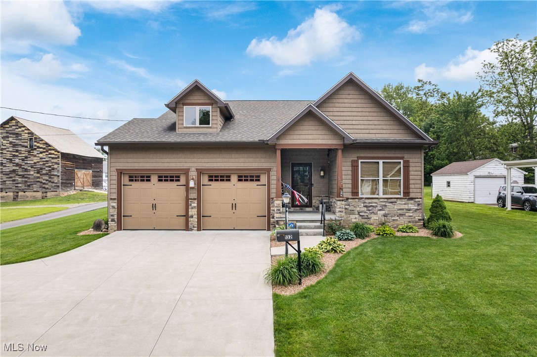 Welcome to 132 Willaman Ave NW, situated in the heart of North Canton. This move-in ready, 2018 custom-built home, nearly 2,500 square feet, has exceptional curb appeal & situated on nearly half an acre. Pride of ownership is evident throughout. Upon entering, the house exudes a warm and welcoming atmosphere. The 1st floor includes 2 full bedrooms, 2 full bathrooms, an eat-in kitchen equipped with a Maytag Chef Rated Range, a GE Elite counter-depth refrigerator, pantry, stainless farmhouse sink, granite countertops and island with seating. The laundry room, adjacent to master suite, features a 5' walk-in shower, dbl vessel sinks, 10 x 7 walk-in closet and charming barn door. LVT flooring is used throughout except for carpet in the bedrooms. The dining space seamlessly extends from the kitchen into the great room, featuring stone and granite gas fireplace. All solid wood poplar doors, ceiling fans, and crown molding are present throughout. The lower-level 13-course basement features an efficiency kitchen with ample cabinetry, a 3rd full bathroom, lap siding wall and a beamed ceiling. It also offers a spacious storage area with sump pump detector system (alarm) & Generac whole-house generator. The 16 x 20 Trex deck, accessible from the great room, includes a 16 x 12 translucent panel serving as a roof. Beyond the deck lies a fire pit, providing warmth on a cool evening, a fenced in backyard and 20 x 8 shed. The extra deep two-car garage is designed with a 12' high ceiling and 8' high garage doors to accommodate taller vehicles. An automatic heat relief fan control is mounted on roof truss. The attic is accessible through the master bedroom and garage. The greenhouse off the deck as well as the ADT wireless security system, which is currently disabled, convey. Any and all exterior decorative lighting and the Ring system do not convey. The roof and mechanical systems are all original. Please refer to the supplement for a complete list of improvements.