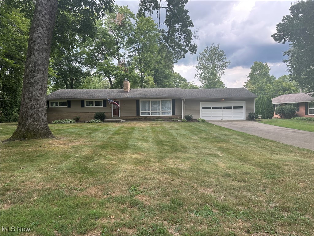 BROKER/AGENTOWNED. Surprisingly spacious ranch within walking distance of Historic Downtown Hartville! The open layout boasts a large kitchen with granite countertops, formal dinning space and two living areas with floor to ceiling picture windows providing lots of natural light. The first floor also includes a cozy master suite with attached bath, two additional bedrooms, with a primary bath. The huge finished basement provides a third gathering area, with hook ups for two TVs and surround sound. A full third bathroom, office, laundry room and exercise room/guest area with a murphy bed. Indoor spaces include tow wood-burning fireplaces (one on each floor), the main floor fireplace has gas logs that can heat the first floor with efficiency, built in shelving and a two car garage that can hold an F250 and has extra shelving for additional storage. there is also a closet in the garage for access to additional storage above the garage and storage in the closet as well. The charm only continues outside on the big private cement patio that looks out into the back yard. Whether you're relaxing with family or hosting a party, the possibilities are endless with so many livable spaces! you do not want to miss this roomy, move-in-ready gem tucked back in a quiet, beautiful neighborhood.
Upgrades in the last 5 years: facia, spouting, well pump, furnace, A/C, garage door opener, 3rd bathroom, office, fireplace hearth, granite counters w/tile backsplash, finished basement (flooring, drywall, ceiling, lighting, insulation, electrical, plumbing fireplace hearth, and cabinets. Updated in the last 5 years: kitchen and 2 bathrooms, laundry room.