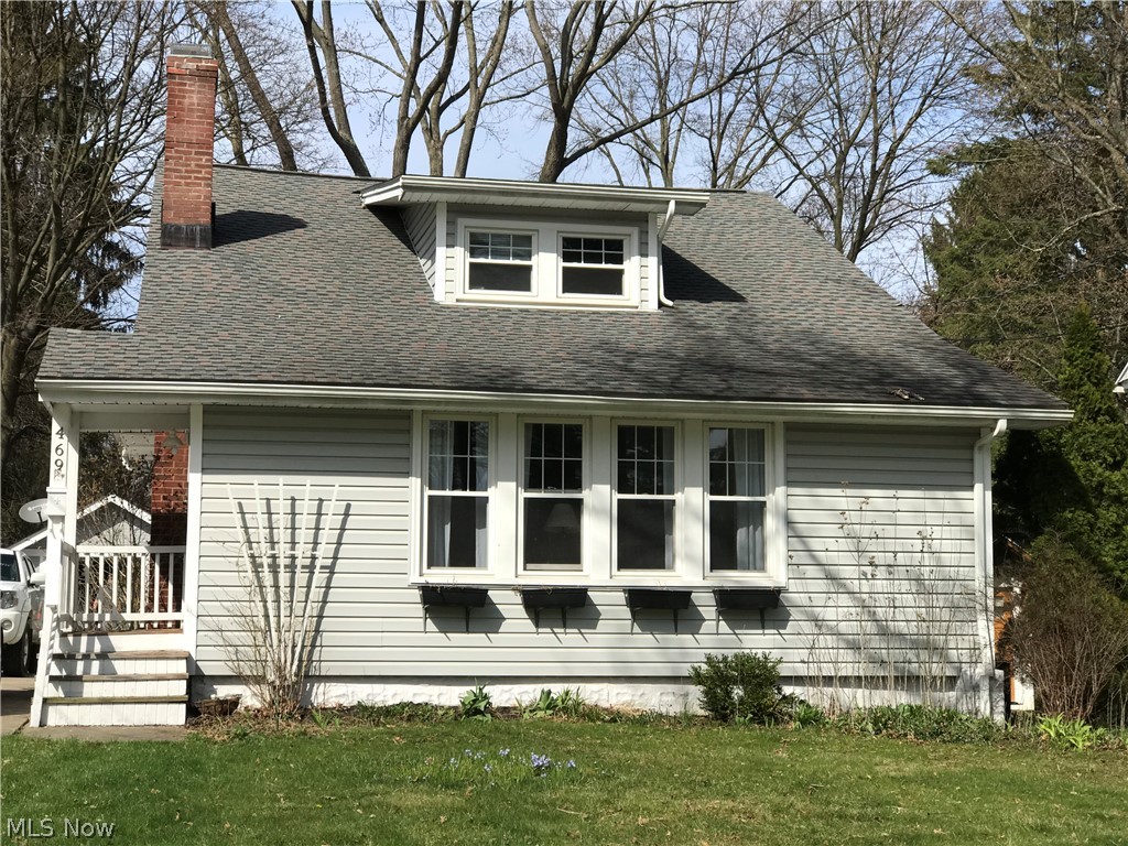 Cute-as-a-button Kent, Ohio 4BR 2BA bungalow. 1940 Charming design w/ built-ins & window seat. All newer kitchen appliances. HUGE screened porch, fenced yard & lovely curb appeal. Roof 8 years old. Vinyl siding, windows & newer entry doors. Gas fireplace w/ newer liner & damper. Bonus area for in-home office or playroom. Cedar lined front closet. Room w/ closet in Lower Level could be 5th bedroom. Large basement workroom too! Close to Route 43 & within walking distance of schools, Hike N Bike Trail, Heritage Park and downtown Kent! One year home warranty has been registered by sellers for buyer! Don't let this one slip away!!!