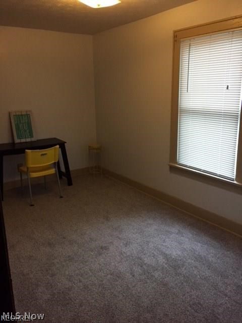 PRICE REDUCED! New carpet in bedrooms! Great investment opportunity! Adorable bungalow on large lot on quiet street. Central air and storm windows. Cozy yet spacious. Nearby shopping, highways, and amenities. Updates: kitchen drop ceiling 2017, kitchen sink and faucet 2017, carpets and paint in BRs 2017, blinds throughout 2017, smoke detectors 2017, bathroom vanity and faucet 2017, hot water tank 2016, new furnace fan 2016, newer partial roof approx. 2015, living room and dining room carpet within last 3 years, kitchen floor within last 5 years. Nice patio out back. Large, freshly painted basement for storage, workshop, and laundry. 100 amp electric service with some newer (yellow) wiring within last 3-5 years.