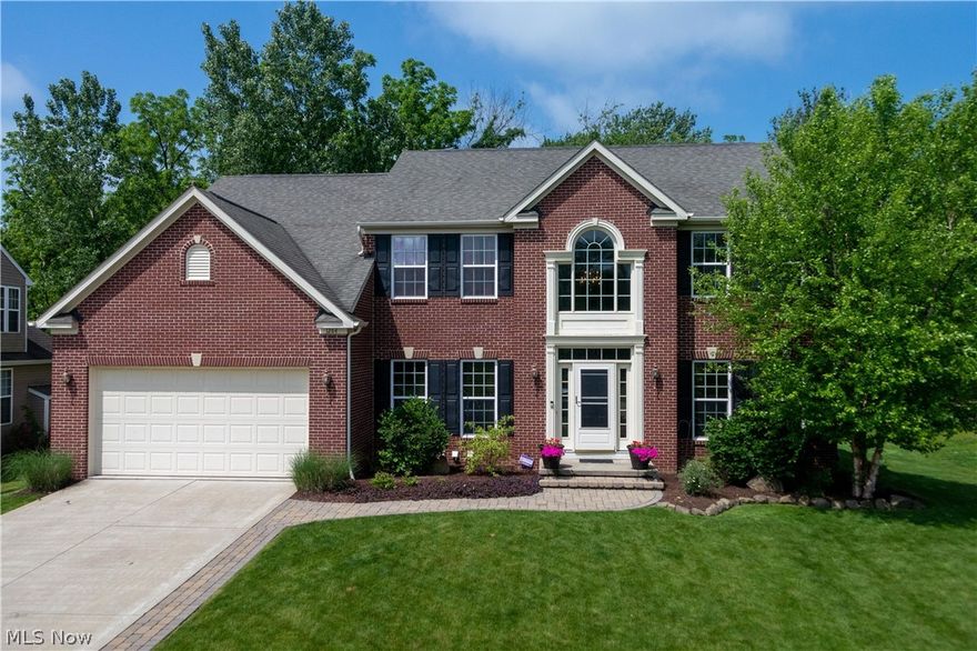 An amazing property in Creekstone of Copley!  Very spacious, open floor plan!  After your tour of this property, you will say "I am home".   Enter through the foyer with hardwood floors that continue into the spacious kitchen with plenty of cabinets, counter space, pantry and island/breakfast bar - all stainless steel appliances convey!  The family room is so spacious and features a beautiful gas fireplace, built in's and lots of windows for an abundance of light.  It is open to the kitchen and eating area.  Sliders off the eating area to the spectacular large stone patio and fire pit for your enjoyment, entertainment and relaxation.  You can even enjoy movie night in your own backyard!  There's also a living room separated by columns which lead to the dining room.  The office, powder room and laundry room compliment the first floor.   Enter the master suite thru french doors offering enough space to create a reading/relaxing area, walk in closet plus another closet with full bath incl