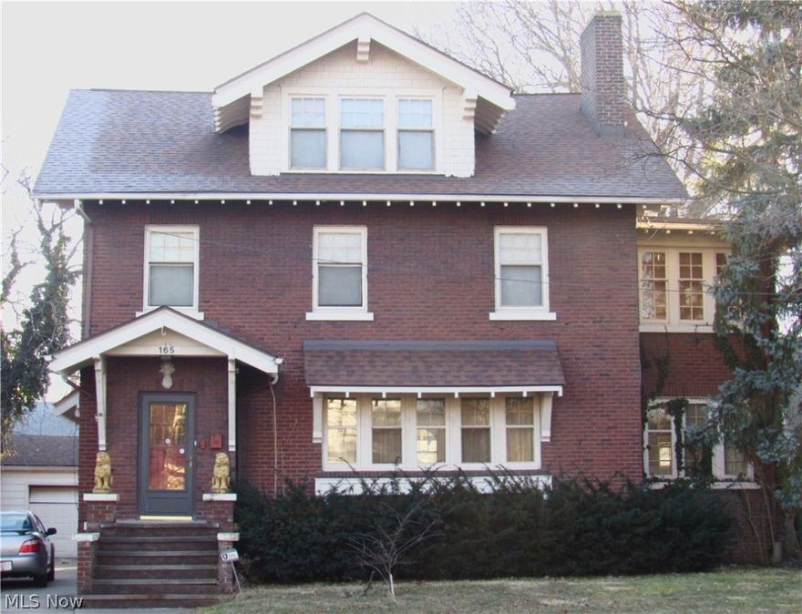 Wonderful Old World Charm in this stately 2.5 story home. Mostly brick home with 2 car garage! Living room the expansive brick fireplace, massive crown molding and hardwood floors. Heated sun room off the living room with a second fireplace. Banquet size dining room with Bow windowed, Coffered wood beamed ceiling and glass french doors to the sunroom. The kitchen has been modernized with newer countertops and updated cabinets- There is  a 5x6 butler pantry with to the ceiling cabinetry. Grand staircase leads to the second floor with 4 bedrooms, another sunroom/study. There is a third floor that has additional living space, 5th bedroom and half bath!.