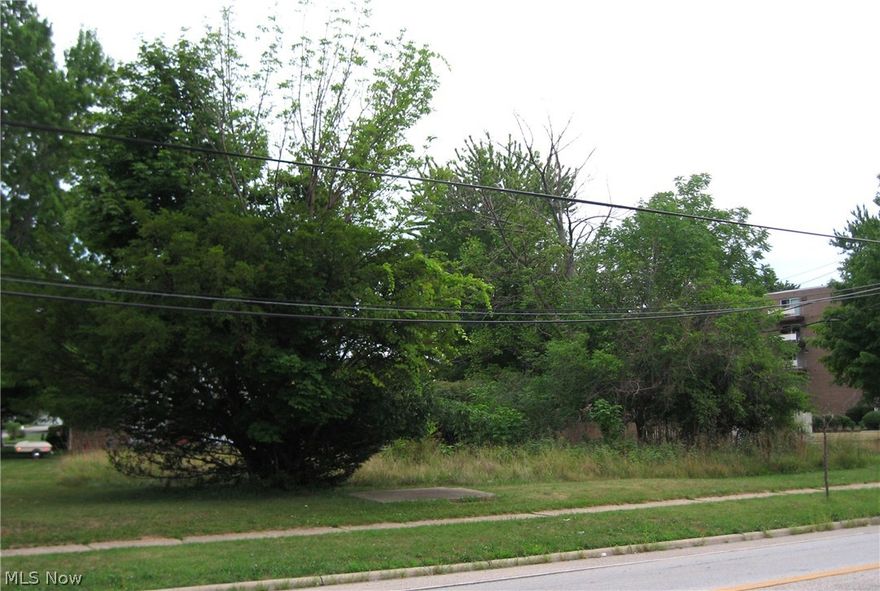 Two vacant lots at the corner of Lake Shore Blvd. and N Parkway Drive in Eastlake. Lots are being sold as one unit. Lots front on Lake Shore, and standing on edge of lot, one can see Lake Erie looking north across Lake Shore.