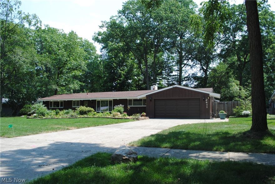 Attractive California Ranch In Desirable Forest Park ... Same Owner Since 1970 ... Wide Open Floor Plan With Tall Windows And Lots Of Natural Light ... Impressive Beamed Ceilings ... Two Cozy Fireplaces ... Spacious Living Room ... Huge-Inviting Family Room ... Formal Dining Room ... Eat-In Kitchen With Appliances, Including Clothes Washer And Dryer ... 1st Floor Utility Room ... Expensive  Stanek Vinyl Windows ... Newer Roof ... Newer H20 Tank ... Large Two Car Attached Garage ... Beautiful Wooded Setting 110' X 167' ...