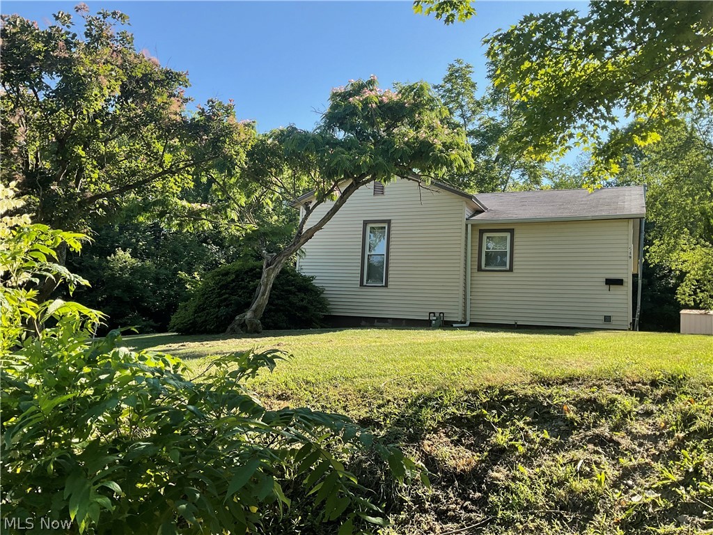 New Listing ! Situated in the Village of Woodsfield in a private country setting, this 3 Bedroom home has lots of space and includes 2.294 acres in town.
This home is a MUST SEE! Spacious bedrooms and the living room has a partial wall that is open into the Kitchen / Dining room area which makes the space feel more open. Windows have been replaced in 2013, Hot water tank 2003, Roof replaced in 2001 and Gas Furnace in 2000. Hardwood floors are beneath the current floor coverings. Mineral rights go with the property. This home is MOVE IN READY! Call for a showing today!