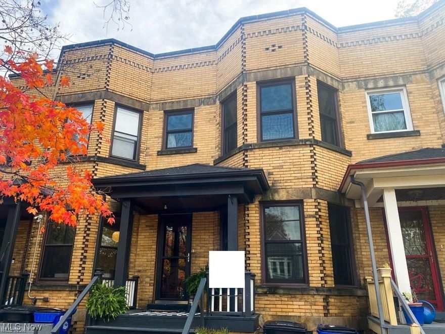 HUGE PRICE REDUCTION!! Stately all brick, two story located in the most fantastic area of Tremont - historic Lincoln Park.  Walking distance to all the local trendy eateries and coffee shops and Tow Path Trial & the Flats.  Bike ride to Downtown Arenas or work! This three-bedroom bath and a half beauty has turn of the century interior architecture with natural woodwork, fireplace mantel, doors, balustrades, trim work and wood floors! Kitchen has undergone a full remodel with white shaker cabinetry, quartz counters, floating wall shelves, custom lighting, new hand scraped acacia wood flooring, and stainless appliances that leads out to a beautiful patio and step down fenced in courtyard. The large living room and dining room, with bay window, for large family/parties.  The gorgeous split staircase leads you to 3 spacious bedrooms finished in today's neutral palate.  You will love the completely remodeled full bath upstairs with mosaic and subway tiles, new fixtures and plumbing in restoration period appropriate finishes.  There is a private parking space at the front of your home that leads to your walk-up front porch and also a new stamped concrete patio for your bistro table to enjoy all the local city sights and take in the smells of the local bakery.  Huge full basement with half bath waiting to be finished! Great investment opportunity. Immediate occupancy.