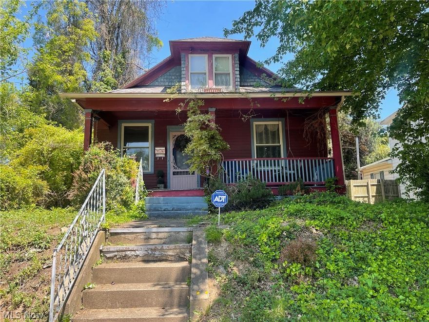 This cottage style home offers a nice size front porch and a large entry living room with pocket doors leading to second living area or study.  The home has a lovely sized dining room, master on the main level, and a full bathroom with antique style tub. The bonus room upstairs is large and a has a half bath.  Home has hardwood floors throughout and four gas heating fire places. A small screened in porch overlooks a nice size yard with alley access behind the home for additional parking. Come add your touches. Home is within walking distance to City Park. All furniture and wall decorations convey with the property.