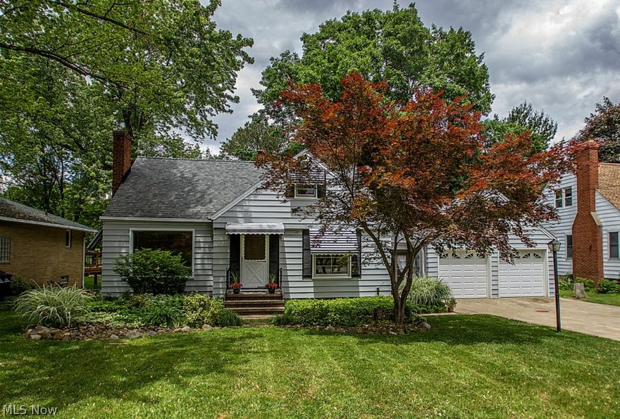 Don’t miss this charming 4 bedroom, 2 full bath bungalow featuring over 1,500 square feet of living area on beautiful deep lot! New neutral carpet was just installed in living room and both downstairs bedrooms in May of 2015, as well as on stairs, hallway and 2 second floor bedrooms. Recent updates also include fresh paint and light fixtures! First floor offers living room with WBFP, 2 bedrooms, full bath with shower over the tub and fully-applianced kitchen with spacious dinette area.  Second floor features quite a bit of additional living space with 2 additional bedrooms, full bath and separate nook area. Lots of room to entertain or just relax in the finished rec room with carpet, wet bar and gas log fireplace! Lower level walks out and up to back yard, and  is also plumbed for additional bath. The two car garage is conveniently attached via finished breezeway area which also gives access to wonderful deck overlooking parklike lot. Enjoy low taxes and the wonderful rec facilities an