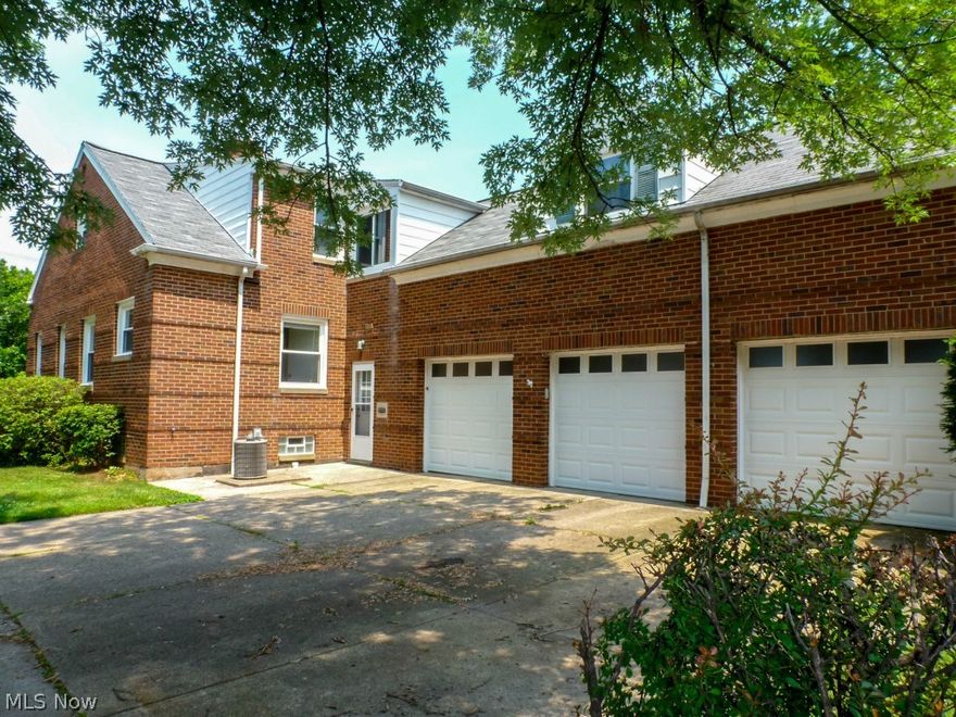 Spacious 4 bedroom, 2.5 bath colonial on a corner lot offers many upgrades and plenty of character. Large living room w/decorative wood burning FP has gleaming wood floors, glass block windows, cove ceiling & French doors to office with walls of windows and wood flooring. Remodeled eat-in kitchen (2010) has lazy Susan, corner cabinet, plenty of storage & all appliances. Dining room w/built in corner cabinets & huge picture window is open to kitchen & living room and is a great place for entertaining. Oversized master bedroom w/cove ceiling has his/her closets. 2nd floor is complete with 2 more bedrooms, one with built-ins & walk-in closet, newly updated bath (2010) w/ceramic tile flooring & surround, marble sink, walk-in cedar closet, laundry shoot and more storage space. Enormous unfinished bonus room. Breezeway to 3-car attached garage w/electric, water & workshop. Finished basement with stone wood burning FP, wet bar, bedroom 4 with full bath & additional room for office, play or wo