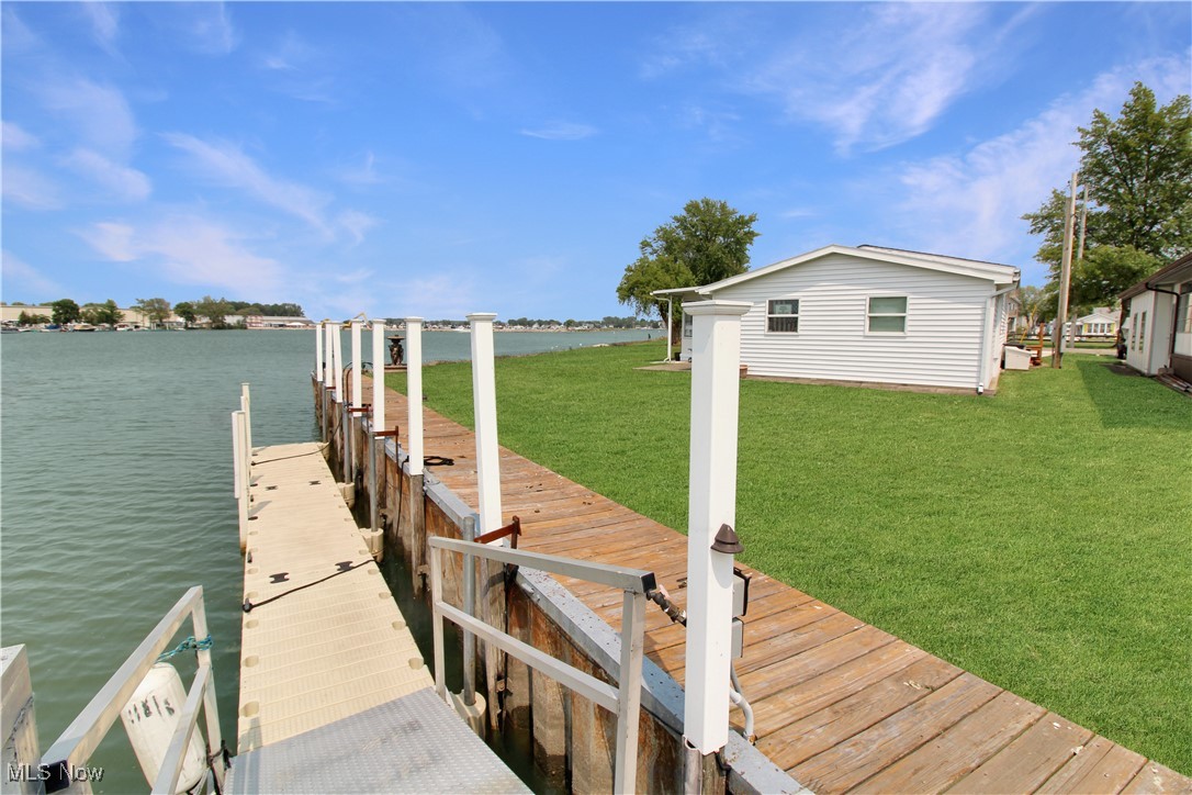 Waterfront ranch on Catawba with 60+ ft dock at the door! 3-bedroom, 2-bathroom split floor plan. Completely updated kitchen. Plus, a brand-new, extended paved driveway to park your water toys. Enjoy the tranquil harbor scenery of boats passing by from your waterfront sunroom. You will enjoy every memory of Lake Erie Living. Located near parks, marinas, vacation activities, shopping, dining, and fun in the sun! Call today to take a look.