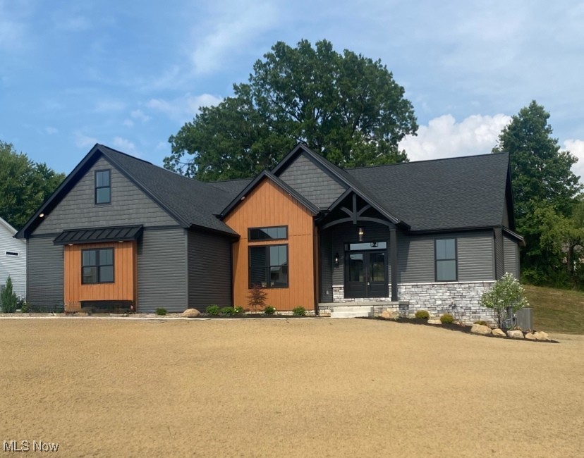 Exciting news — this home now features gorgeous new professional landscaping to complement its stunning design!
Discover this exceptional modern craftsman home — a brand-new Hostetler Family Homes creation offering 4,045 sq ft of beautifully designed living space. Situated on a half-acre in desirable Jackson Township, this home combines timeless craftsmanship with modern amenities for a truly luxurious and functional lifestyle.
The main level boasts an open-concept living area with soaring cathedral ceilings and abundant natural light. The split floor plan provides privacy, featuring a spacious master suite with a walk-in closet that connects directly to the laundry room. Two additional bedrooms and a bright home office with 11-foot ceilings complete the first floor. The chef’s kitchen includes an oversized pantry, grocery delivery door, and seamless flow to the living and dining spaces. Step through a large sliding door to a covered deck — perfect for enjoying the outdoors.
Upstairs, you’ll find a versatile 599 sq ft bonus room with a full bath and closet — ideal as a guest suite, media room, or playroom. The finished basement offers over 1,100 sq ft of extra living space, with an egress window and partially enclosed patio for entertaining or quiet relaxation.
Additional features include a 3-car garage, 9-foot ceilings, and energy-efficient design. Enhanced by its brand-new landscaping and prime location near shopping, dining, and schools, this home offers the perfect blend of style, comfort, and convenience. Don’t miss your chance to make it yours!