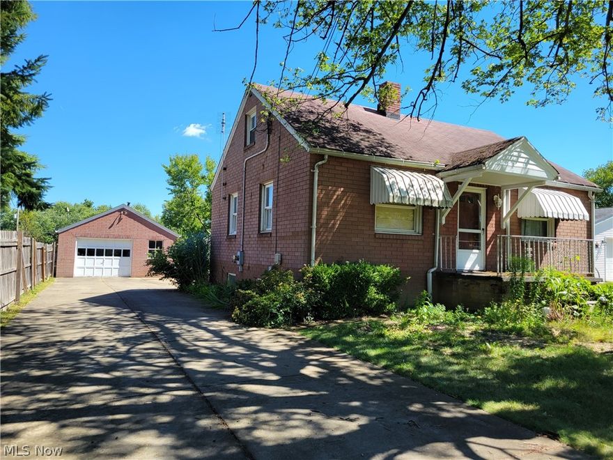 Brick 4 Bedroom Cape Cod, Full Basement and 1.5 car Garage that has a floored attic with pull down stairs. This home is situated on a double lot on a dead end street! If you like Gardening, this is the house for you!! Mature garden areas and in the raised beds they are growing tomatoes, peppers and more, a strawberry patch, there's an apple tree and 5 rows of concord Grape Vines! The vacant lot to the right is also included. 
The large 1.5 car Garage with door opener. Don't wait to see this house located in a nice, quiet neighborhood in McDonald village!