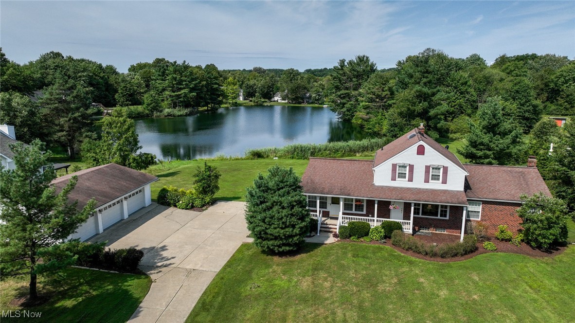 Welcome to your private slice of country paradise in the bucolic village of Boston Heights! Nestled on 1.6 acres of land with scenic lake views, this was the original homestead house at Annabelle Lake. You’ll feel the stress of the day melt away as you pull into the drive of your own private retreat. The spring fed lake provides the perfect backdrop for all your gatherings of family and friends. Imagine a waterfront garden party or a peaceful afternoon of fishing and boating. The current owners hosted a gorgeous wedding event where the oversized garage was temporarily transformed into a reception/ dance hall! Country charm embraces you in each room and nook of this delightful home. From the welcoming kitchen to the cozy living room and inviting family room, you’ll love to call this special place home. The layout can accommodate every stage of life from a young single or couple, to a growing family, to seniors who want easy one floor living. The primary bedroom suite is tucked away in the back corner of the main floor allowing you to enjoy the benefits of this peaceful lifestyle for years to come.
Nestled by the Cuyahoga Valley National Park, Boston Heights is a charming village with a unique blend of rural beauty and convenient commutes to Akron and Cleveland. Known as the gateway to Ohio’s only national park, it offers spacious, tranquil living with natural attractions like the 60-foot Brandywine Falls and the East Rim Bike Trail, as well as winter fun at Boston Mills Ski Resort. Education is top-notch with Nordonia Hills schools, and accessibility is easy with nearby highways and the Ohio Turnpike. Whether you're seeking a permanent country escape or a weekend retreat, this lakeside home offers the space, natural beauty, and tranquil setting to create lasting memories in one of Ohio's most peaceful communities.