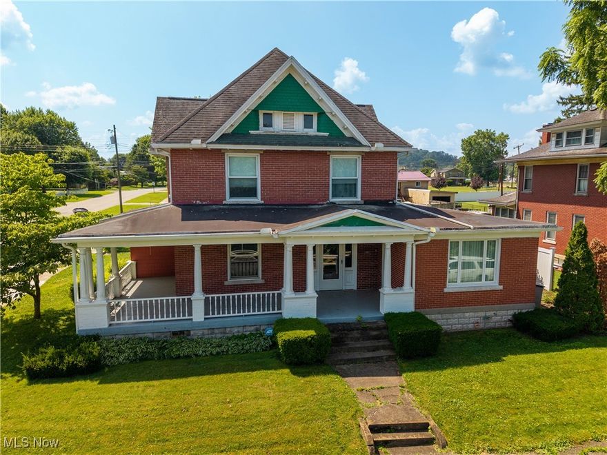 For the first time on the market! This exquisite home, complete with a guest house, is available solely due to relocation. As you step through the front entrance, you'll be greeted by an original staircase and a wealth of beautiful woodwork and trim, leading into the formal living room, which features an ornate tile design around the gas fireplace and large picture window showcasing your Ohio River property and view. The spacious formal dining room is perfect for entertaining, equipped with a side entry and yet another remarkable fireplace. The family room is filled with natural light and provides access to the front porch or the expansive back patio adorned with a pergola. The first-floor bathroom boasts both a walk-in shower and a luxurious clawfoot soaking tub. The remodeled kitchen showcases a distinctive layout, ample storage, a breakfast bar area, solid surface countertops, and a back stairway leading to the upper level. The upper floor features four generously sized bedrooms, with the primary bedroom offering a picturesque view of the river, a second full bath, and access to the walk-up attic. This property has been meticulously cared for, and a list of updates is available upon request. This one of a kind property includes Ohio river frontage!  A bonus to this property is your own private guest house cottage consisting of living room area, dining space, a kitchen, two bedrooms and private laundry facilities. Owners get $500.00 a month rent with long tern tenant.  This home would make a great mother-n-law suite, AirBNB, office space or so much more. Address for guest house is 302 Henderson Ave. This one is truly not a drive by. All buyers to be pre-qualified.