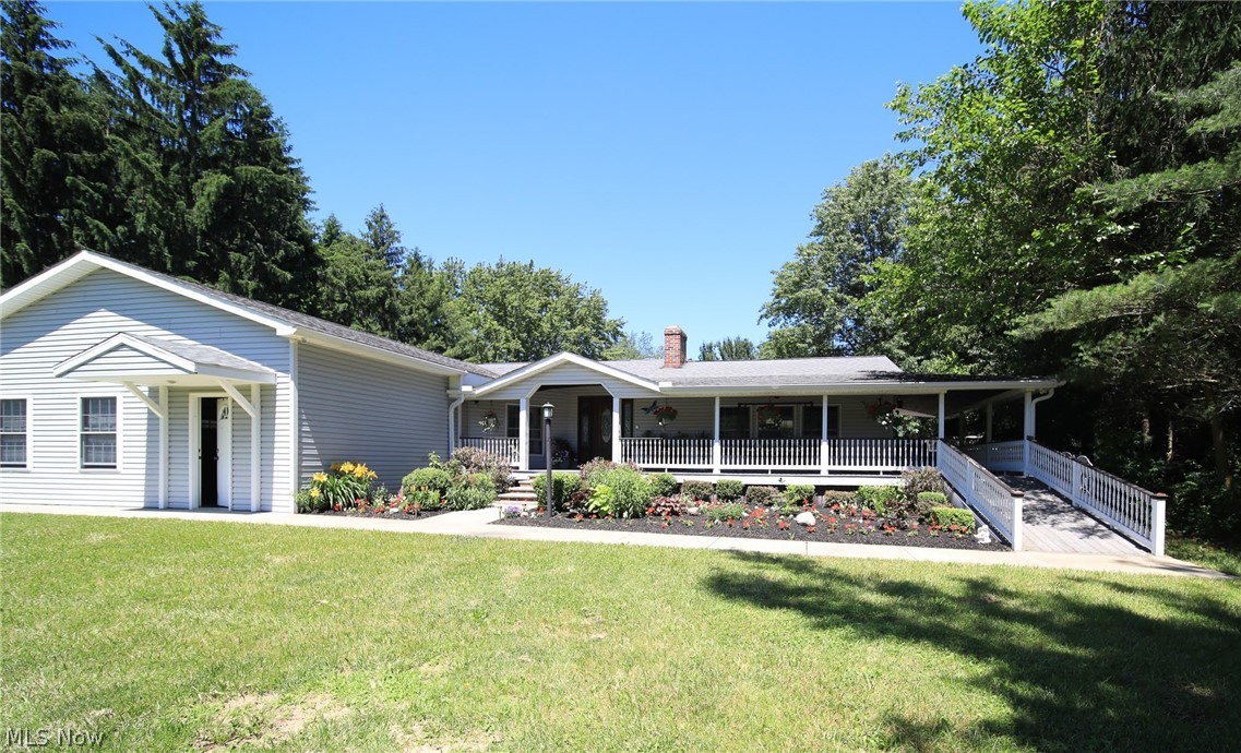 Wow, One floor living at its best! This home is MUCH larger than it appears from the road! Over 3000 sq. ft. of total living space including a fully finished basement in this beautiful Ranch home. Lower level would make a great mother in law suite or teen suite with a full bathroom, entertaining living space and bedroom. This home has one of the biggest great rooms i have seen, boasting over 1000 sq.ft.complete with a full bar and a 70" HD Tv! With the push of a button, a motorized 120" HD projection screen lowers for a theatre like experience. Also, featured throughout the home are Anderson wood windows installed in 2012, 3/4" oak flooring with commerical Waterlox finish. The custom designed kitchen is sure to please the chef in the home. A large island with granite counter tops,all oak cabinetry, pantry, fireplace, computer center and a Pella security glass door that leads out to a great entertaining patio. Enjoy a hot tub, bar area, tv, surround sound speakers all fenced in for you