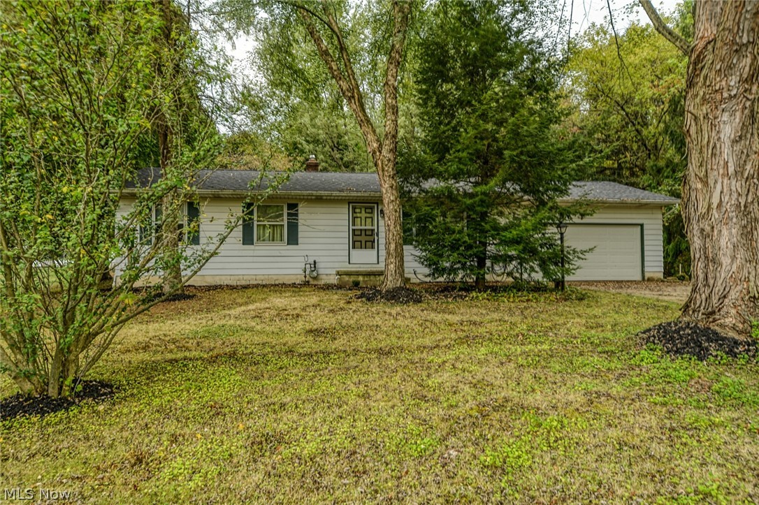 Looking for a large ranch home that offers privacy and awesome updates? This is the home you've been waiting for! The home has a brand new roof and is surrounded by nice mature trees. The backyard has beautiful landscaping and a large covered porch that is perfect for entertaining! There is a nice sized storage shed with a concrete floor. When you walk in the front door you will notice a ceramic tile foyer, a wood burning fire place with built-in shelves, and a large window that offers natural light. There is a large, gourmet eat-in kitchen equipped with updates of the highest quality that will not disappoint! The kitchen updates include cabinets that provide plenty of storage, newer flooring, quartz countertops, under cabinet lighting, and an awesome pantry with pull out shelves. You cannot miss the top- of- the- line stainless steel appliances, including a double oven! Down the hall, you will find 3 large bedrooms each with great closet space. The master bedroom has 2 large windows a