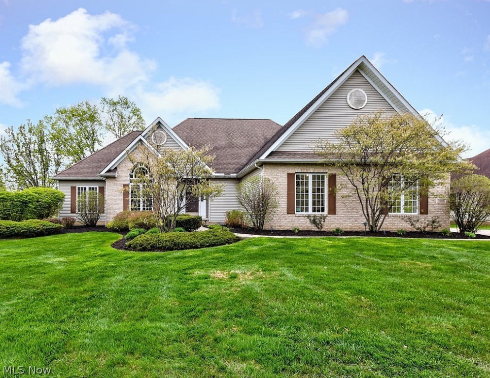 Beautifully Updated Ranch with Open Floor Plan in Quail Hollow! 3 bedrooms, 3 full baths. The welcoming foyer leads to the dining room and spacious great room with gas fireplace, floor-to-ceiling windows, and soaring ceilings. The eat-in kitchen is open to the great room and features brand new appliances, granite counters, and double oven. Split bedroom design. The master bedroom boasts hardwood floors, large walk-in closet, and a newly remodeled en suite with jetted tub and walk-in shower. On the opposite side of the home, you will find 2 more good-sized bedrooms with new carpet (2018) and another remodeled full bathroom. The laundry room leads to the heated oversized 2-car garage with refinished epoxy floors. The lower level provides a huge recreation room, wet bar with full size refrigerator, full bath, and a versatile space that could be used as a fourth bedroom or office. Enjoy the outdoors on the freshly painted deck surrounded by beautiful landscaping. All doors, walls, ceilings