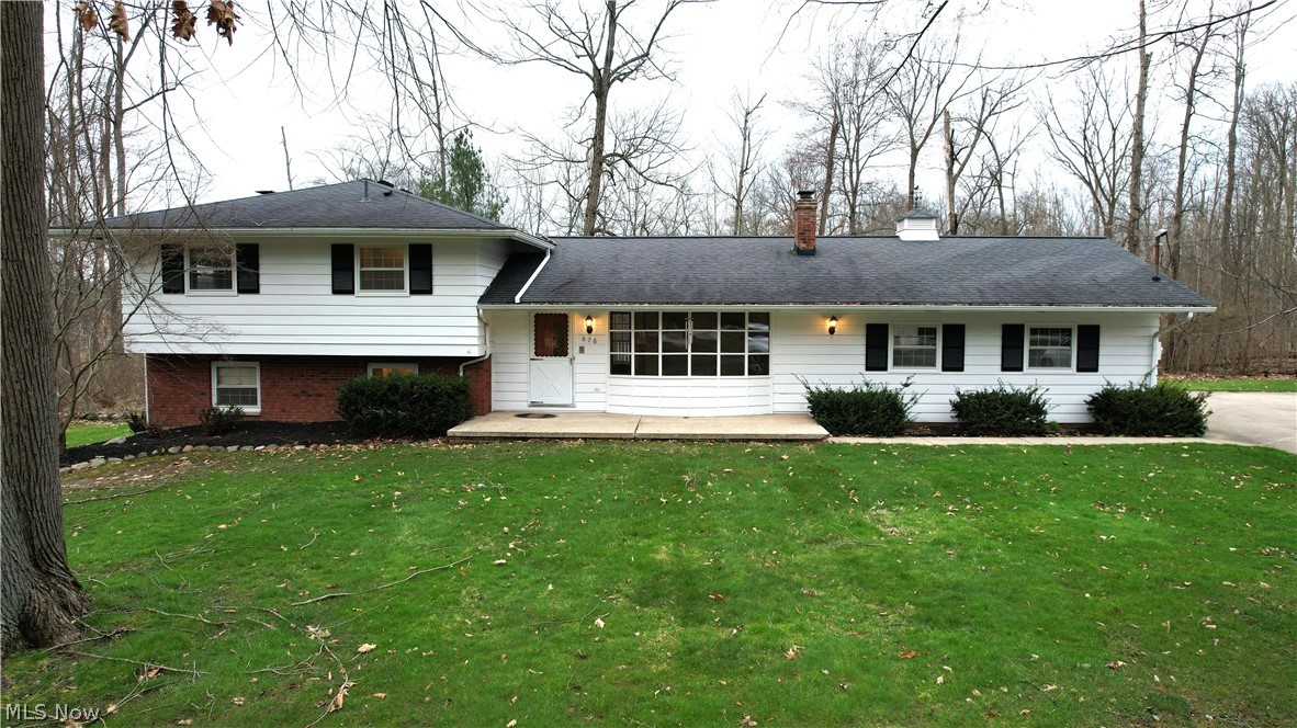 Situated on 2.75 acres, this split-level home has been meticulously cared for by the same owners for over 50 years, boasting timeless charm. With three levels of living space, this home offers ample room for a family to thrive. 4 Bedroom, 2 Full Bathroom home has been lovingly maintained and awaits its next owner.The main level showcases beautiful hardwood floors throughout most of the home. A sunlit living room with a picture window overlooks the front of the property, providing a welcoming atmosphere. The heart of the home is an updated kitchen, boasting granite counters, stainless steel appliances, and hickory cabinets. The sliding doors off the dining area lead to a generous composite deck, perfect for indoor/outdoor dining and entertaining. Upstairs, you'll find three additional bedrooms and a full bathroom, providing privacy and comfort for family members. The lower level features a cozy family room with a wood-burning fireplace and slider doors leading to the patio, offering serene views of the backyard. Additionally, there's a fourth bedroom, a full bathroom, and access to the basement from this level. Highlights of this home include a 2-car attached garage, as well as a 3-car detached garage built in 2005, providing ample parking and storage space. The roof and gutters on the house were updated in 2013, ensuring peace of mind for the new owner. Furnace 2014, AC 2022, Septic 2022, Basement waterproofed by Ohio State waterproofing in 2000 with a lifetime warranty. Overall, this well-preserved home presents a rare opportunity for a family to enjoy comfortable living in a tranquil setting, with modern updates and classic charm seamlessly combined.
