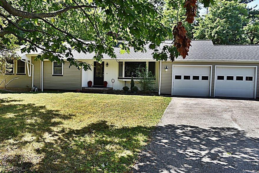 Prepare to be amazed at all this home has to offer!  Step into the front foyer and you'll see the wonderful Living Room with large picture window, Fireplace and beamed ceiling.  Living Room opens to a back Family Room with sliders to the wooded backyard.  Formal Dining Room with built-ins for extra storage is steps away from the amazing HUGE Eat-in Kitchen which was upgraded when the addition to the home was built.  Vaulted Ceiling, eat-in area with another slider that leads to the wooded backyard and another wonderful window with views, built-in appliances and tons of storage...plus a large pantry 'area' that gives you even more storage options. There's a second large Great Room off of the kitchen that was being used as an office, but what a beautiful room with a gorgeous picture window and more of those private views. Primary Bedroom with great closet space and Bath are also a part of the addition with vaulted ceilings, soaking tub and separate shower. Small Bedroom is connected to the Primary and hallway for a nursery or small office.  2 more Bedrooms and Full Bath complete this level.  Original Bedrooms have hardwood floors under carpeting. Full Basement has TONS of possibility with a 2nd Fireplace area and the step-down basement area from the addition will leave you speechless. Was being used as a workshop but would also have room for so much more!  Theater Room, workout room, craft space...the options are endless. Attached 2 car garage has an office with separate entrance or could be used for additional storage if needed.  And all of this on a 2.53 ACRE WOODED LOT!!!  New Siding in 2025, newer roof 2020 and some newer windows. Kitchen, primary bedroom / bathroom and large office / great room addition 2003-2004. Close to all the amenities that Brecksville has to offer...close to freeways, shopping, entertainment and so much more.  Welcome Home to 6522 Mill Road!