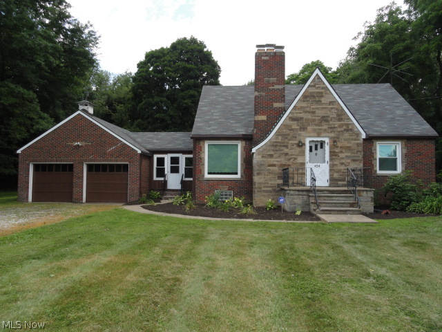 This cozy brick cape sits 100 feet back off the road on a .7 acre lot with over 1600 sq. ft. of living plus a large basement including a rec room with fireplace. Light, bright and clean throughout! Beautiful hardwood floors. Spacious living room with fireplace opens to dining area and kitchen. Two bedrooms on first floor and two bedrooms upstairs. Nice concrete deck porch to view the big open backyard. Newer windows and roof and updated electric panel box too! Solid Tallmadge home. Convenient to shopping.