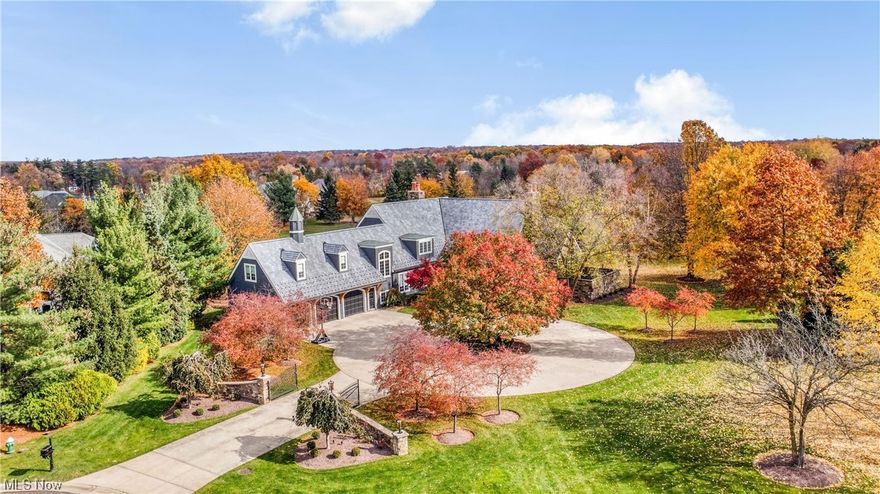 This is truly a stunning luxury home in the very desirable Barrington community! The home features 2+ manicured acres (which is unusual in this development), Wide-planked pecan hardwood flooring on the main floor, 2-story family room with floor to ceiling windows and sliding doors that lead to the wrap around deck, views of the 7th fairway, plus high-end fixtures and finishing touches throughout!  The walk-out lower level is an entertainers delight! It is nicely finished with its own kitchen/bar area, wine rack, fireplace, and sliding glass doors to the stamped concrete patio and water feature.  The first floor owner’s suite exceeds  expectations with its vaulted bedroom that connects to dual walk-in closets including an oversized dressing room with a fireplace. The master bath has 2 vanities, a two person shower, a soaking tub, and access to a private patio.
Please also be sure to check out the YouTube video tour!!