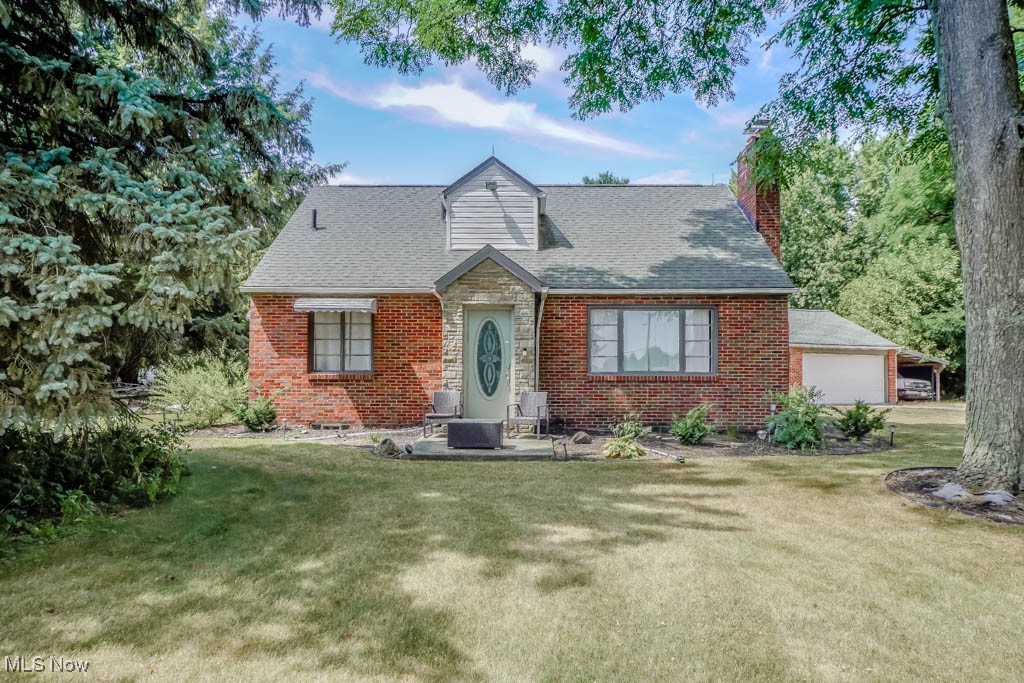 Tucked back from the road, this spacious brick cape cod sits on 1.42 acres, offering plenty of space to enjoy both inside and out! Nicely updated with a newer hot water tank, Trane furnace, and newer flooring throughout the main level. Sunlight fills the living room through a large picture window, highlighting the cozy gas fireplace. The eat-in kitchen features updated LVP flooring, painted cabinets, and stainless steel appliances, with a convenient mudroom nearby for coats and shoes. Two main floor bedrooms share easy access to a half bath, while upstairs you’ll find two more bedrooms with high ceilings and a full bath with tub and shower. The lower level is perfect for entertaining, with a rec room that includes a bar, space for games, and a lounge area for gathering with friends and family. Outside, graded flower beds with weed barrier make gardening simple, plus there are fruit trees and extra room to grow your own vegetables. A two car garage with carport, mineral rights that provide FREE GAS and a prime location close to everything make this Jackson Township home even more appealing. Schedule your showing today to see everything it has to offer!