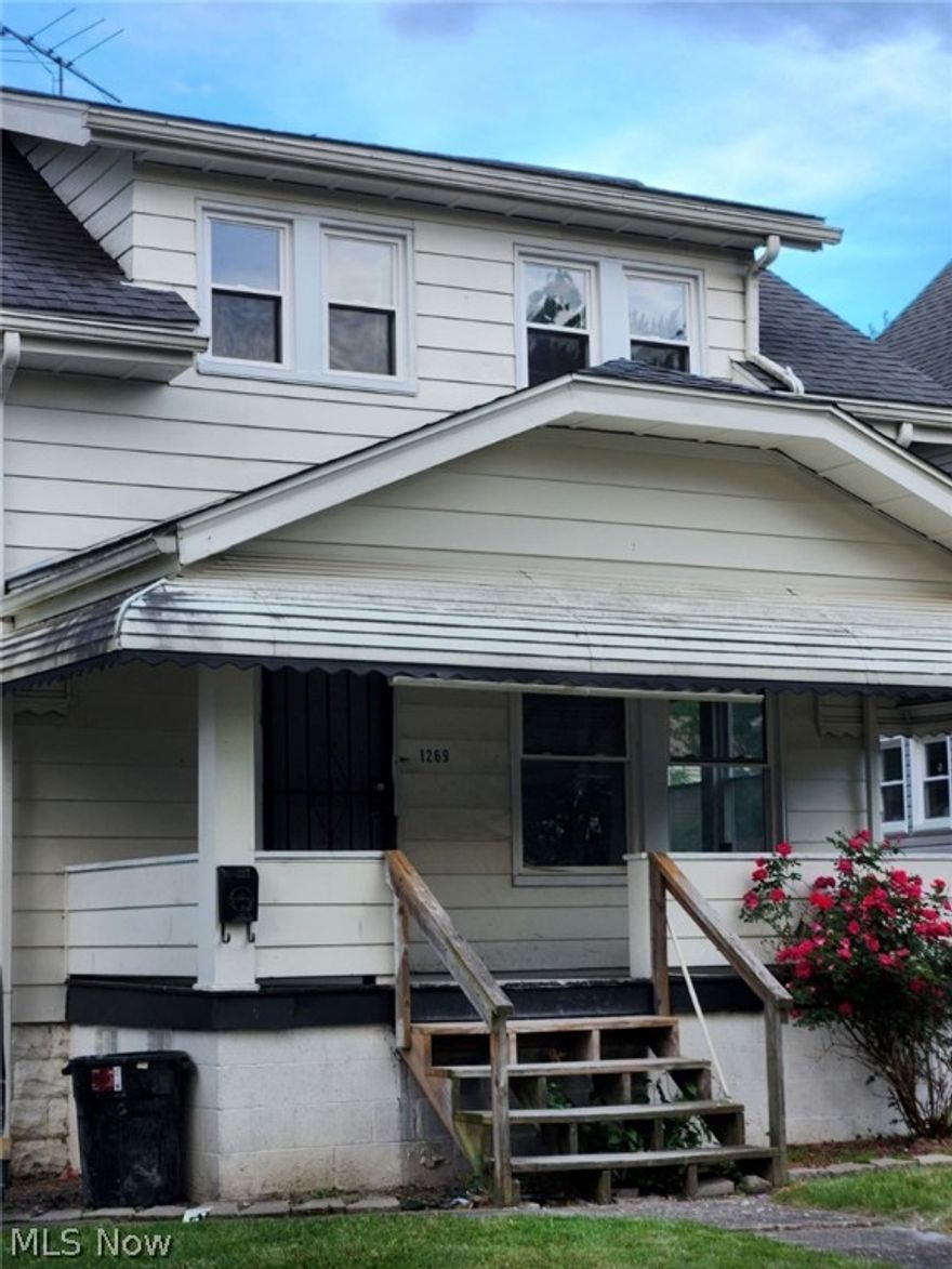 Adorable two-bedroom bungalow!  Enter this home from the covered front porch into the living room and dining area.  The off the dining area is a kitchen with lots of countertop and cabinets.  The back door in the kitchen leading to the back stoop.  The upstairs has two bedrooms with closets and there is a common bathroom at the top of the stairwell.  The downstairs is a full-sized unfinished basement with laundry hookups.  There is a paved driveway leading to the two-car garage.