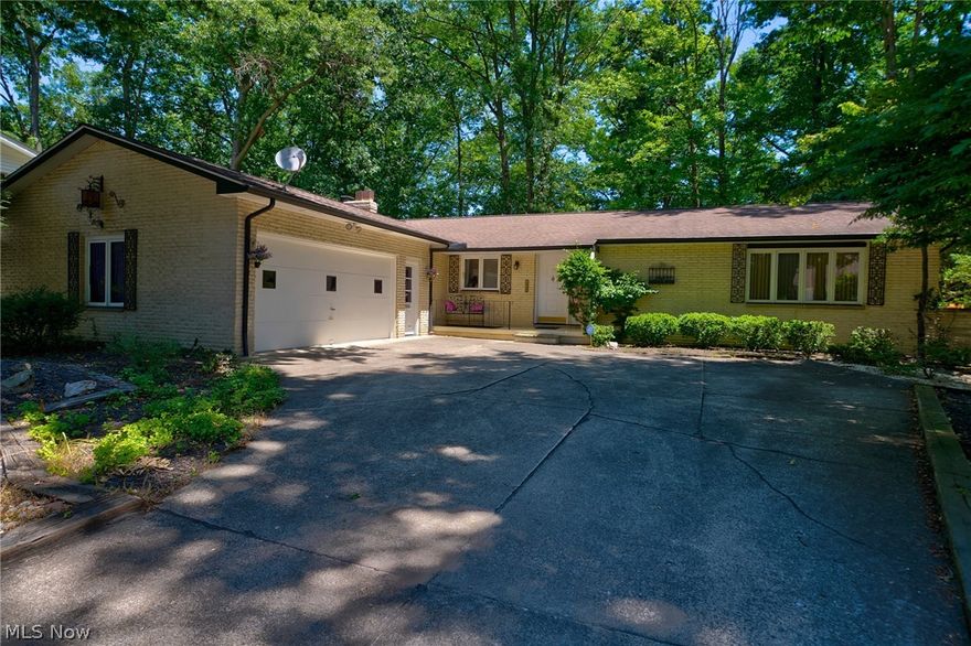 What a find! This charming Brick Ranch with a finished walk-out basement offers an array of delightful features. The dining room and den share a cozy double-sided fireplace, creating a warm and inviting atmosphere. Enjoy direct access from the dining room to a spacious deck, perfect for outdoor dining and relaxation. While the seller believes the main level boasts beautiful wood floors throughout (excluding certain areas), they are not entirely certain.

The finished basement is a true highlight, featuring a full built-in wet bar, custom shelving, and an additional fireplace, ideal for entertaining. Step outside from the basement onto an expansive brick patio that spans the length of the house, offering a serene view of the treed ravine. This home is a must-see!

All this on a quiet cul-de-sac road.