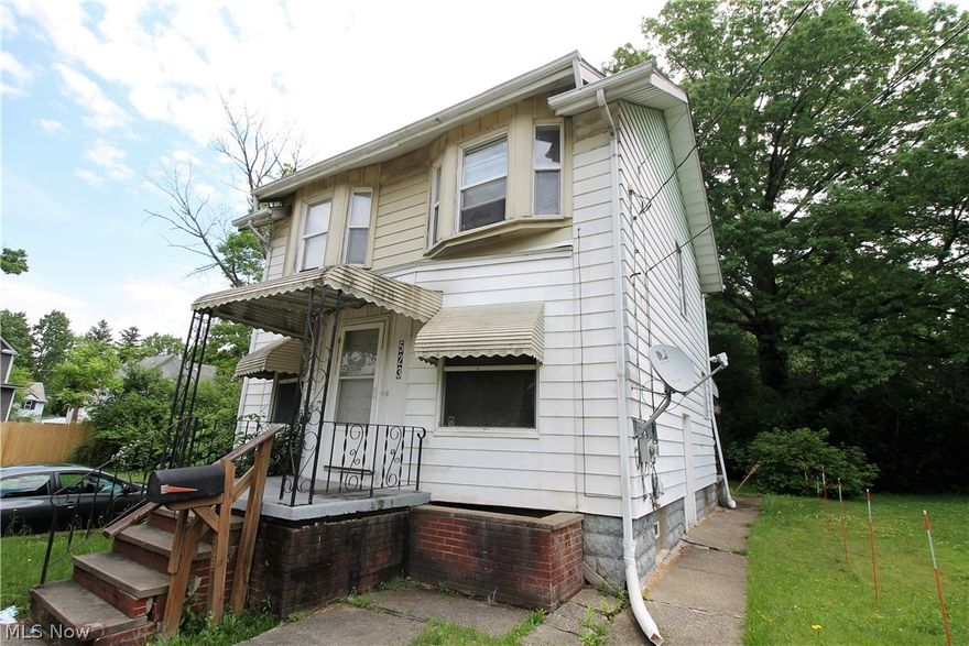 Investor's lucky find! Charming three bedroom, one full bath colonial home. Family room with ceiling fan, dining room, kitchen all on the mail level. Upstairs you have three bedrooms, and a full bathroom. There is a full unfinished basement with laundry area.  The backyard has a covered patio to enjoy. Currently this home is rented for $800/month, all utilities paid by the tenant.  New roof 2019. Close to the Akron Zoo.