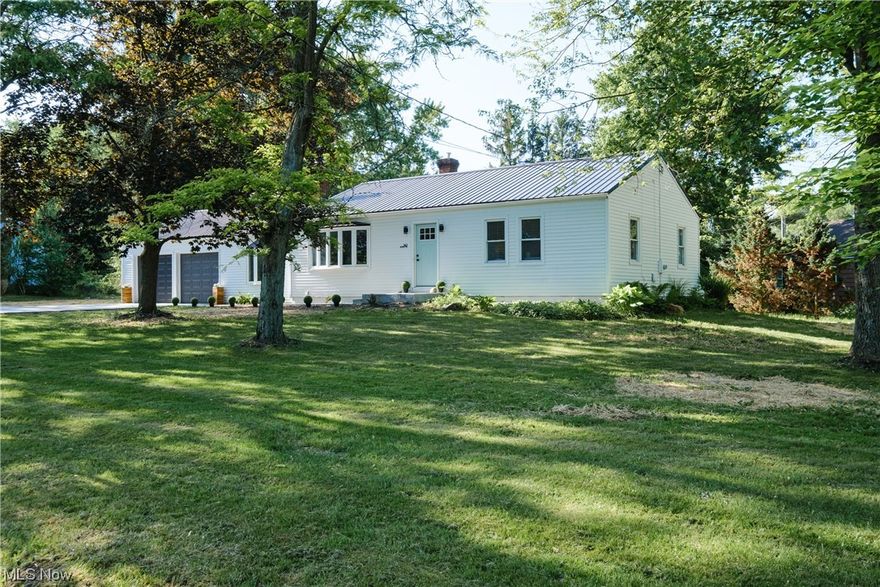 Welcome to your dream home! This beautifully updated 4 bedroom, 2 bathroom ranch in the highly sought-after Hudson school district is a true gem. No expense has been spared in the top-to-bottom renovations, ensuring your peace of mind. From the electrical system to the water lines, septic system, furnace, driveway, metal roof, and more - all major capital expenses have been replaced. Step inside and be amazed by the spacious open floor plan that seamlessly connects the living spaces. The kitchen features quartz countertops, high-end black stainless steel appliances, and stunning modern tile. The main living area boasts durable Shaw LVT flooring, providing a modern yet functional design. Make your way down the steps to find a partially finished basement perfect for an additional entertaining space, bedroom, or office. Outside, you'll find a generous yard space that offers endless possibilities. Imagine relaxing on a wrap-around deck, tending to your own garden, or having an outbuilding