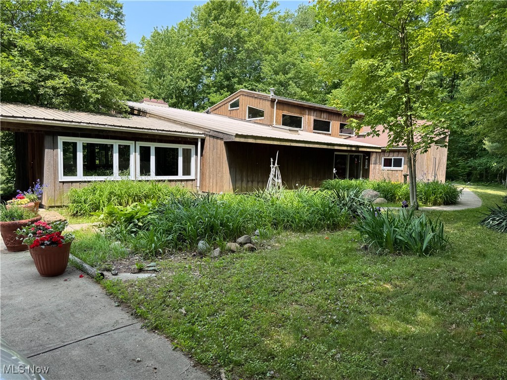 Welcome to this beautiful and secluded mid-century modern home featuring four bedrooms and three bathrooms. The interior showcases stunning cedar walls and high ceilings throughout, complemented by a spacious great room that includes a floor-to-ceiling fireplace and large windows that highlight the secluded scenic woods. The property gracefully slopes down the hill, facing a peaceful babbling creek.
As you enter, you'll be greeted by a striking foyer lined with high windows that enhance the natural light. This leads to a large room equipped with a second eat-in kitchen; all appliances will remain, along with an additional floor-to-ceiling fireplace. The master suite features a private full bathroom. On the second level, there are two additional bedrooms, one with an enclosed sundeck overlooking the sequestered property. A generously sized bathroom with high ceilings and tall windows provides ample natural light.
The main floor includes a sizable kitchen with all appliances, which connects to a formal dining room.
Downstairs, you'll find another bedroom, a huge recreation room that could also serve as a fifth bedroom, an enclosed porch, a bathroom with a walk-in shower, and a laundry room.
Don’t miss this unique opportunity—call today to schedule a viewing before it's gone!
Call today to see before this unique opportunity is gone